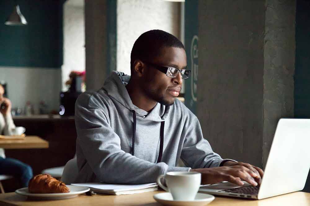 A man works in a cafe